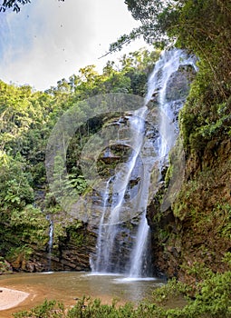 Stunning waterfall among the dense vegetation