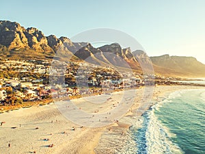 Stunning wide angle aerial drone evening view of Camps Bay, an affluent suburb of Cape Town