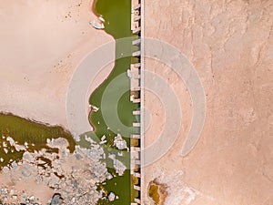 Stunning wide angle aerial drone view of the dry riverbed and an old dam with rests of water near Ai-Ais Hot Springs photo