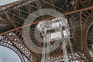 Stunning wide shot of the Eiffel Tower in detail with dramatic sky.