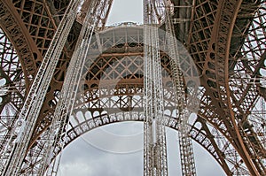 Stunning wide shot of the Eiffel Tower in detail with dramatic sky.