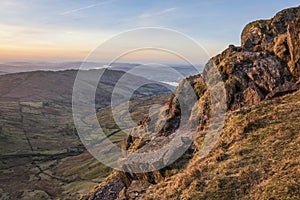 Stunning Winter dawn landscape view from Red Screes in Lake District looking South towards Windermere with colorful vibrant sky