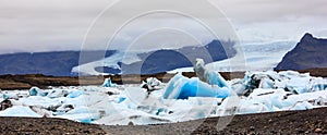 Stunning winter day view of Jokulsarlon, glacial river lagoon, large glacial lake, southeast Iceland, on the edge of VatnajÃ¶kull