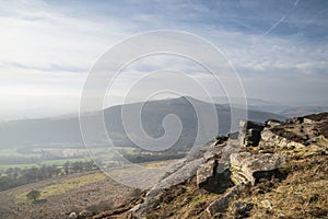 Stunning Winter landscape image of the Peak District in England viewed from Bamford Edge with Lose Hill and Mam Tor visible