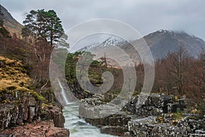 Stunning Winter landscape image of River Etive and Skyfall Etive Waterfalls in Scottish Highlands