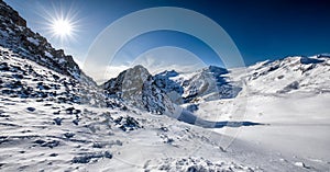 Stunning winter panorama in Tonale ski resort. View of Adamello and Presanella glaciers, Italian Alps, Europe