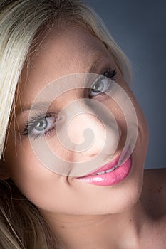 Stunning Young Blond Female green eyes, smiling