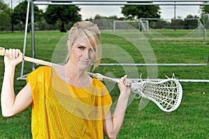 Stunning young blonde female lacrosse player