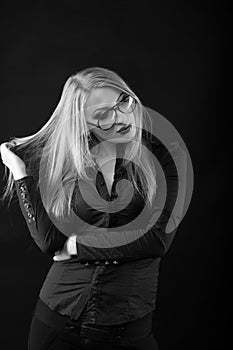 Stunning young lady with straight hair in eyewear and blouse