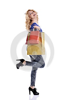 Stunning young woman carrying shopping bags