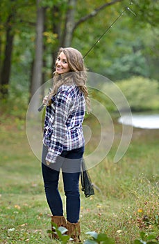 Stunning young woman fishing