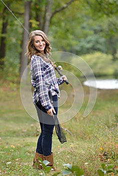 Stunning young woman fishing