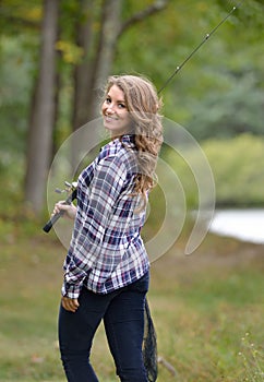 Stunning young woman fishing