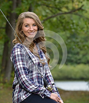 Stunning young woman fishing