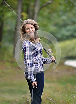 Stunning young woman fishing