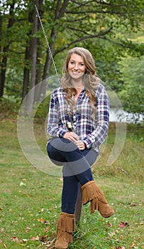 Stunning young woman fishing