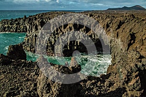 Stunningly beautiful lava caves and cliffs in Los Hervideros after sunset Lanzarote Canary Islands Spain. Travel concept