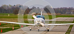 Stunt airplane landing on the air strip in closeup, recreational sport and hobby, air transportation background