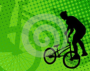 Stunt bicyclist on the abstract background