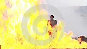 Stunt girl in a fiery explosion.