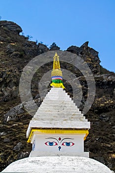 Stupa with Buddha eyes in Nepal Himalayas mountains