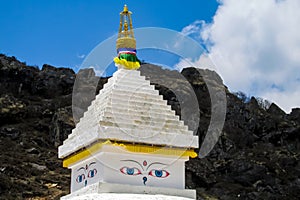 Stupa with Buddha eyes in Nepal Himalayas mountains