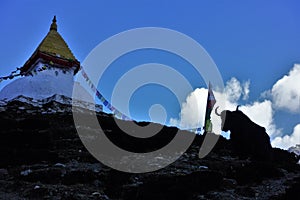 A stupa with Buddha's Eyes and a Yak in Nepalese Himalayas