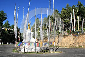 stupa and buddhist prayer flags (bhutan)