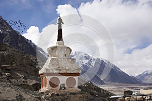 Stupa or chedi in Maitreya Buddha statue and Diskit Monastery or Deskit Gompa at nubra valley village at Leh Ladakh, India photo