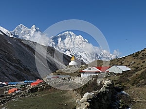 Stupa in Dingboche and high mountain Thamserku