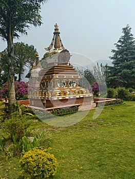 Stupa and the fountain in the Kopan Monastery, Kathmandu, Nepal photo