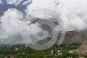 Stupa and mist on the mountain in Leh town.