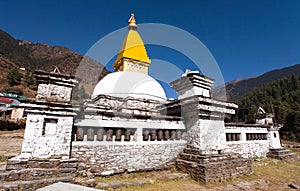 Stupa and prayer wheels in Junbesi village photo
