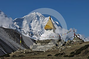 Stupa and snow capped mountain Thamserku