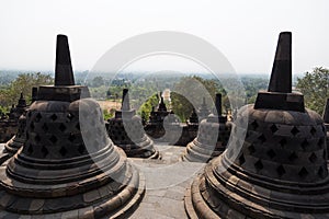 Stupas of Borobudur temple, Java, Indonesia overlooking the landscape