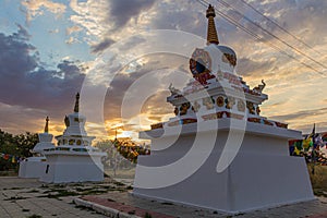 Stupas and flags near Syakusn Syume, Geden Sheddup Choikorling Monastery, Tibetan Buddhist monastery in Elista, Republic