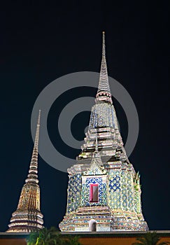 Stupas of Wat Phra Chetupon Vimolmangklararm at night, Bangkok,