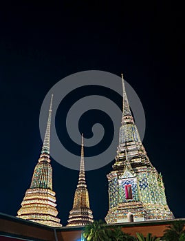 Stupas of Wat Phra Chetupon Vimolmangklararm at night, Bangkok,