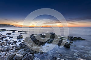 Stupendous rocky seacost after sunset