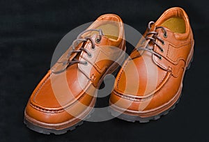 Sturdy brown laced walking shoes. photo