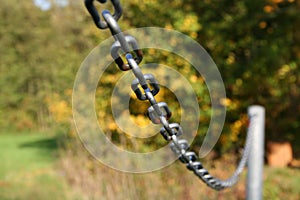 Sturdy chain of iron on a lawn