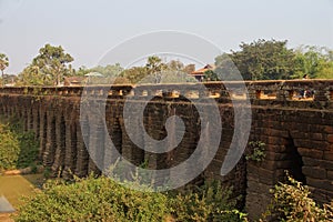 Sturdy corbeled arches of Angkor bridge,