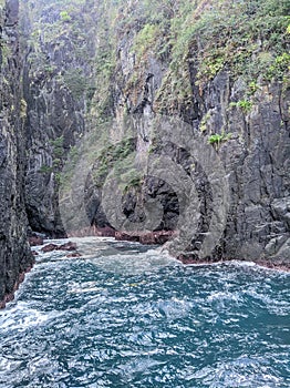 Sturdy rocks with blue sea water are a beautiful view