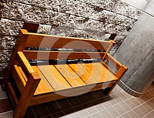 Sturdy wooden bench with arms