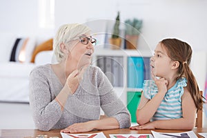 Stuttering girl and speech therapist photo