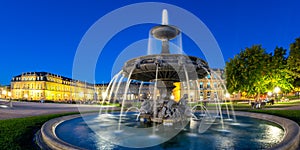 Stuttgart Castle square Schlossplatz Neues Schloss with fountain travel panorama by night in Germany