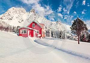 Stuuning winter view of Vestvagoy island with typical norwegian wooden red house, Norway, Europe.