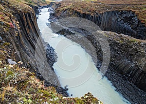 StuÃ°lagil canyon is a ravine in JÃ¶kuldalur, Eastern Iceland. Famous columnar basalt rock formations and JÃ¶kla river runs