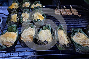 Style Food, Thai grilled egg in banana leaf cup in mae kampong village,Kai Pam, Chiang Mai, Thailand