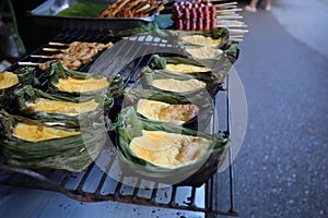 Style Food, Thai grilled egg in banana leaf cup in mae kampong village,Kai Pam, Chiang Mai, Thailand